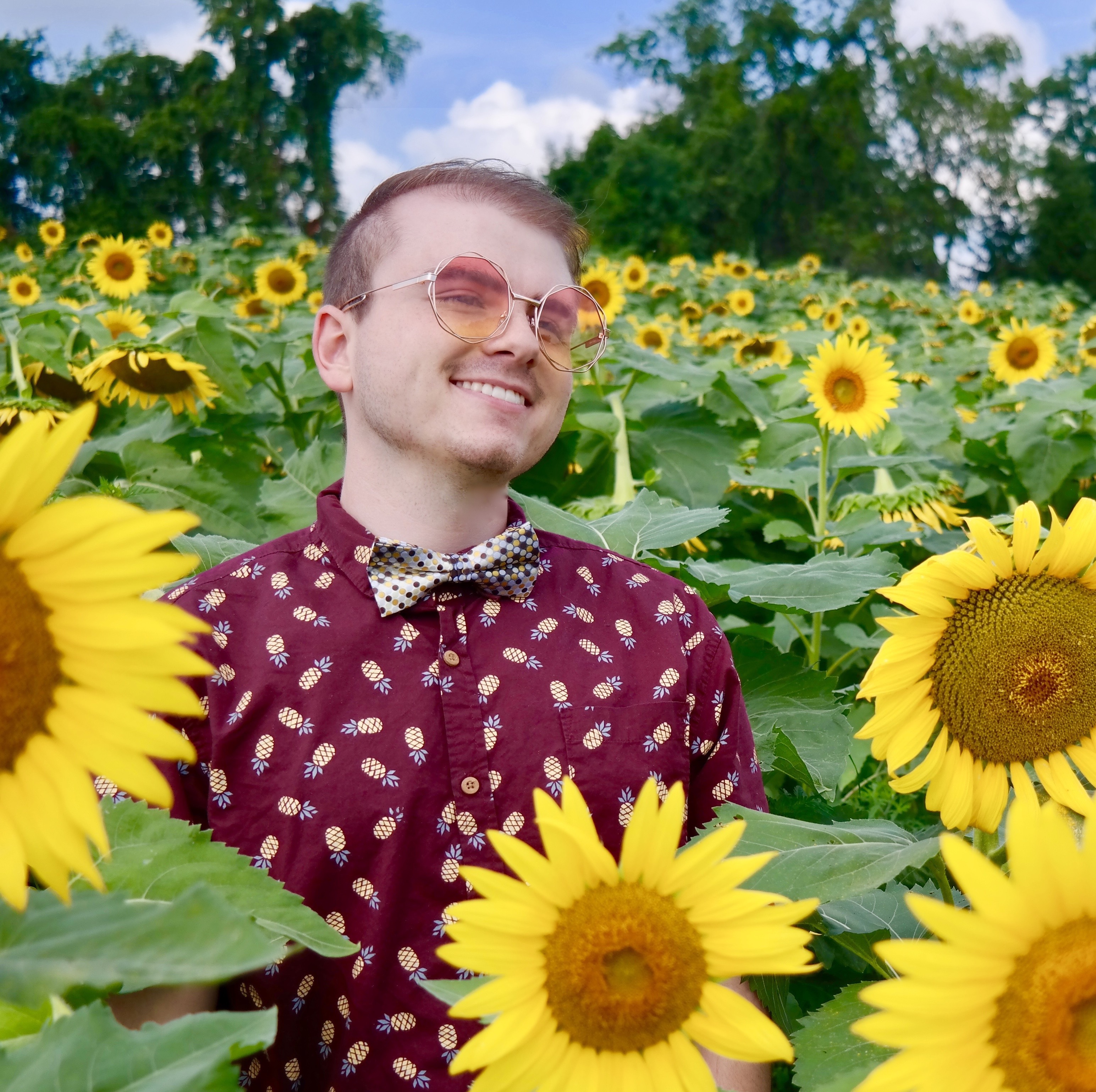 Caleb in a sunflower field